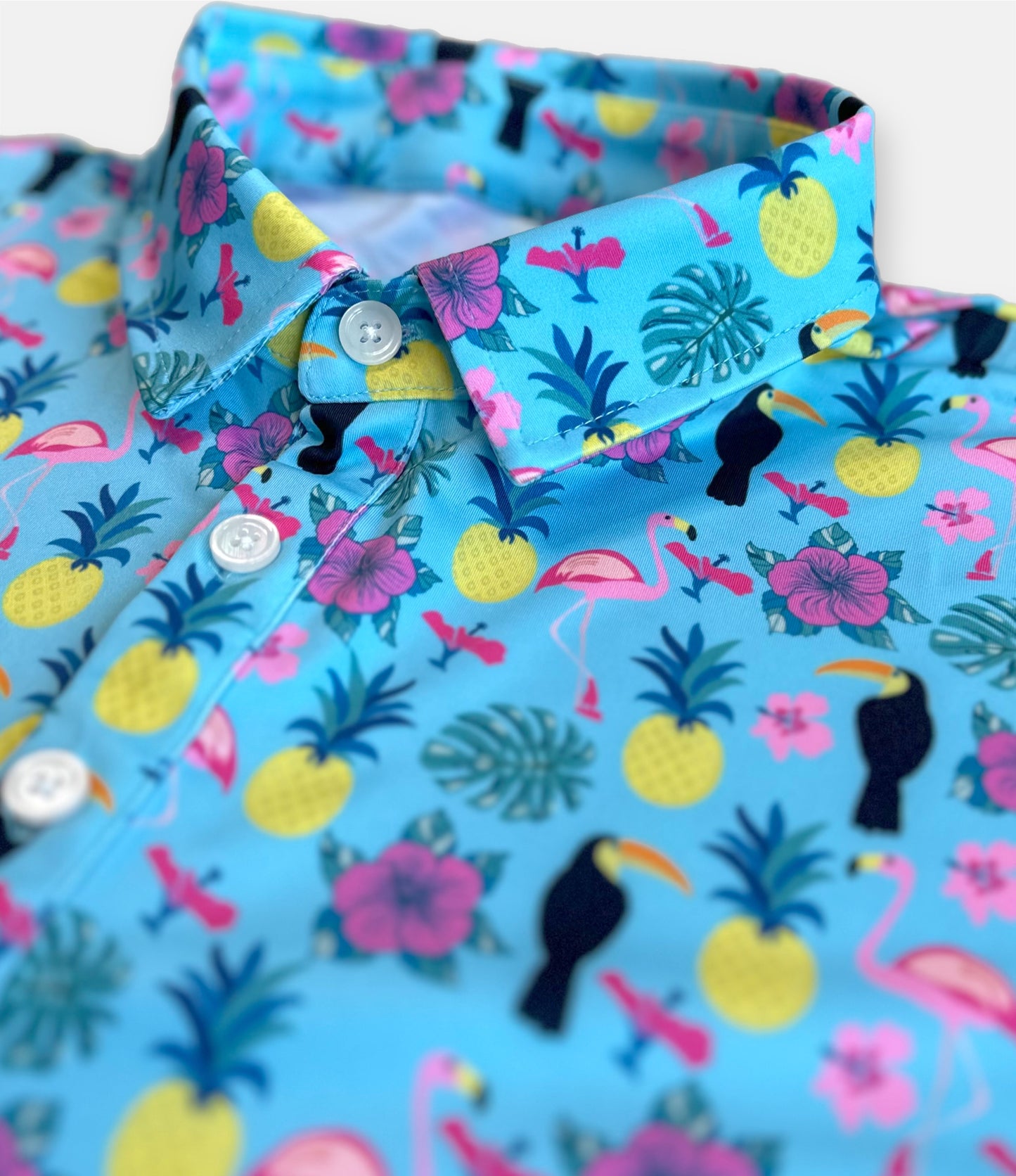 tropical golf polo with fun floral and flamingo patterns