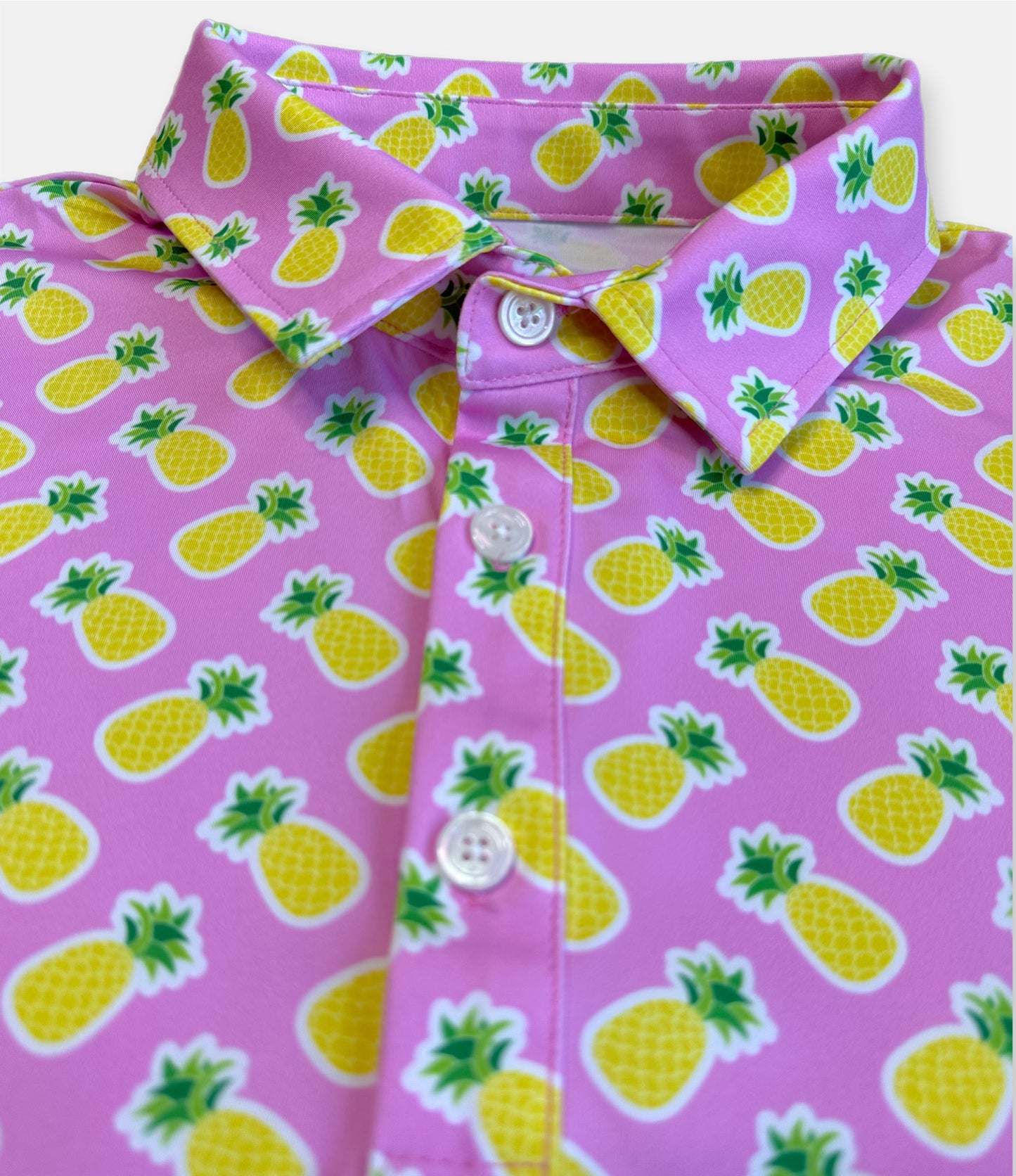 wild tropical golf polo with a pink pineapple pattern