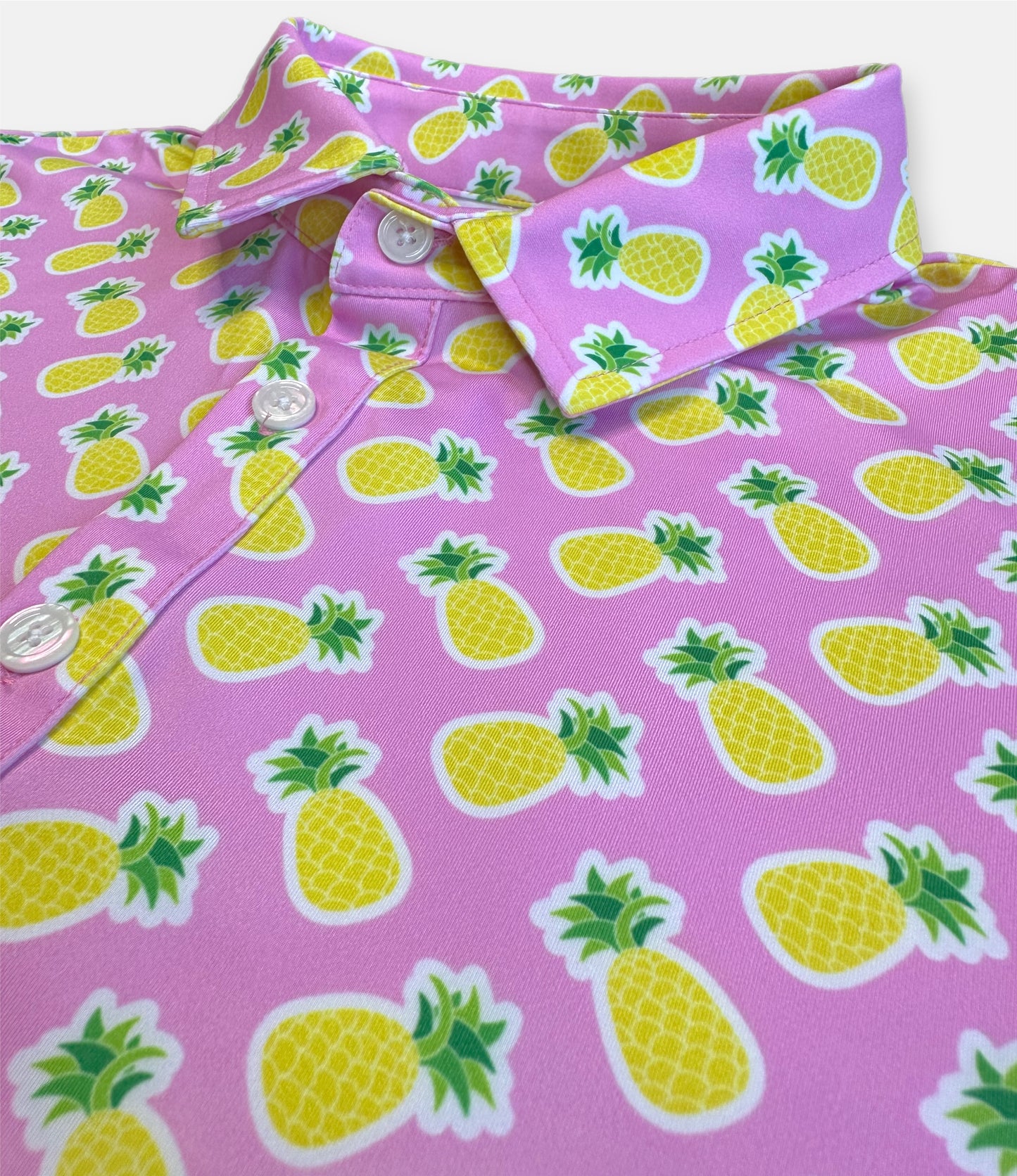 wild tropical golf polo with a pink pineapple pattern